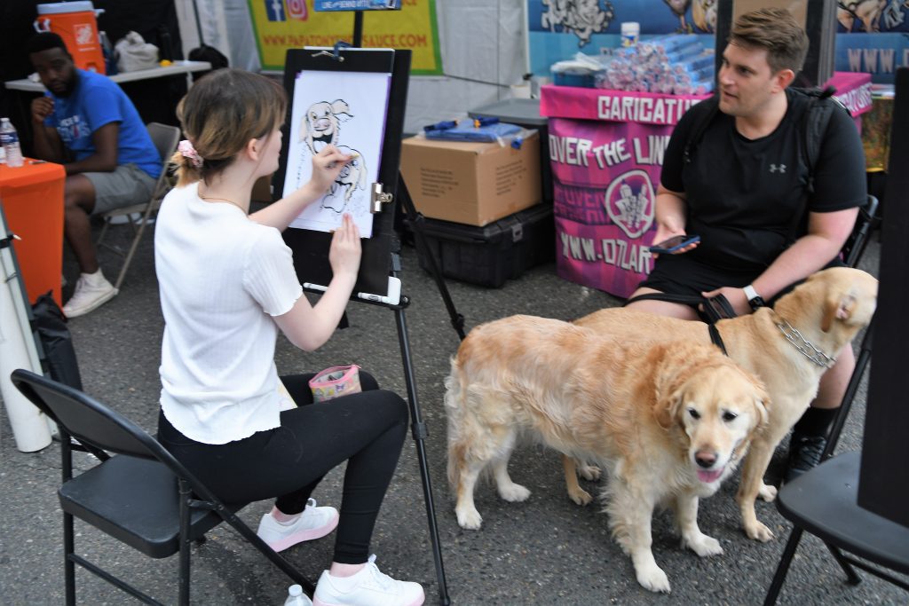 An artist at work at West Seattle Summer Fest 2022