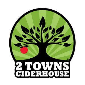 Logo for 2 Towns Ciderhouse featuring a stylized black tree with one red apple on a green background, with the company name in bold white text below.